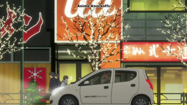 A car driving past a ua shop