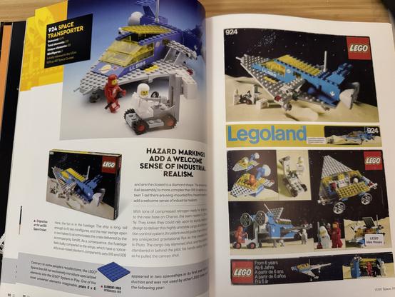 View of a page spread inside the book “LEGO Space: 1978-1992”, featuring the “924 Space Transporter” set.