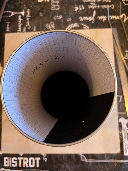 Top down view of the inside of the can, on the bottom right is a big hole in the wall which will be covered with the aluminum foul with the pinhole. This side of the wall as well as the bottom of the can is covered with black velour. The rest of the wall is covered with checkered paper that is replaced by the photosensitive paper.