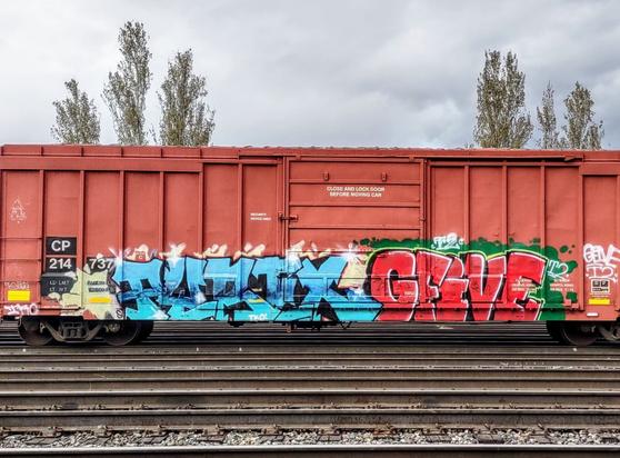 Train car with graffiti rolling through Kamloops BC Canada