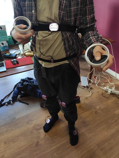 Julian standing, wearing 7 Slime VR trackers on his legs, hips and arms