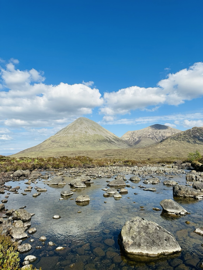Glamaig (Scottish Gaelic: Glàmaig) is the northernmost of the Red Hills on the Isle of Skye in Scotland. It lies immediately east of Sligachan. It is one of only two Corbetts on Skye. From many angles the hill resembles a perfect cone of scree, though it is linked to the rest of the Red Hills by way of a bealach, the Bealach na Sgàirde(Pass of the Scree). In 1889, a Gurkha named Harkabir Tharpa scaled Glamaig in 37 minutes; his total time for the round trip, starting and finishing at sea level in the bar of the Sligachan Inn was 55 minutes. Legend has it that he ran it in bare feet, and his record stood until the 1980s, despite being attempted by Olympians such as Chris Brasher in the 1950s. From Sligachan one route of ascent (whether running or hillwalking) is simply to head up the scree aiming for the summit - this climb is very arduous, due to the unrelenting gradient and the slipperiness of the scree. Descent may be made by way of ascent.