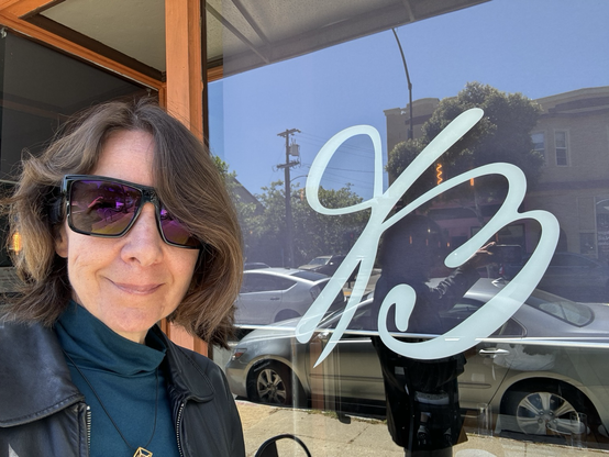 Nicole Lazzaro standing in front of an Italian restaurant.
