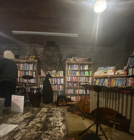 A barlckdrop of books for a stage at a performance.