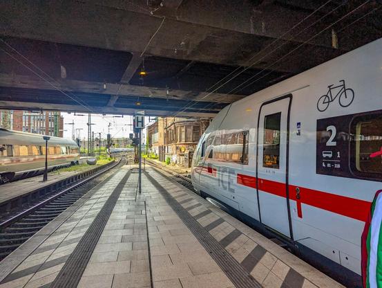 a front of a German ICE train with a bicycle sign by the front door