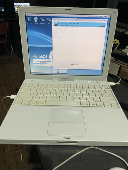 Old off white Mac iBook G4 in process of installing morphos