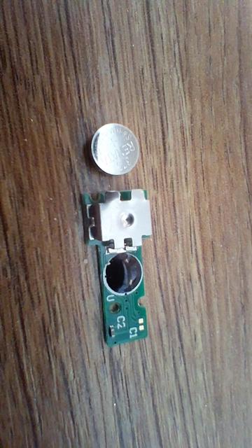 The chip on it's own and the replacement battery just beside. I hope the picture makes it obvious where the battery goes.