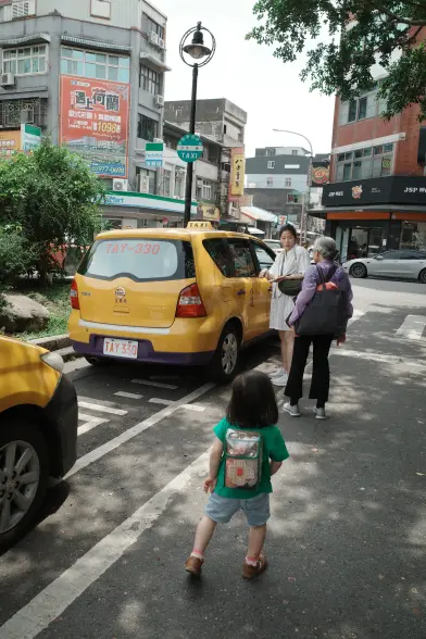 People about to get into a taxi