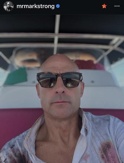 A Mark Strong selfie that shows him with sunglasses and an open shirt