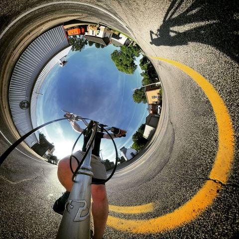 One of a series of photographs showing people biking on a bicycle trail near Mankato, Minn., in summertime.