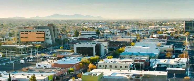 Photo of Las Cruces, New Mexico, looking down into the town, with the Organ Mountains visible to the east.