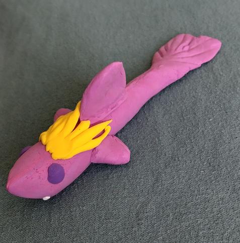 Pink clay shark with purple eye and yellow hair