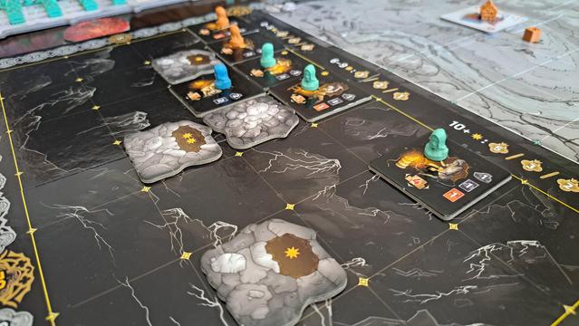 The mining tunnels, showing a network of mine tiles. Some tiles have miner figures in player colours on them to mark they belong to that player.
