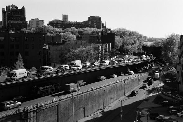Converging traffic lanes at the foot of the Brooklyn Bridge