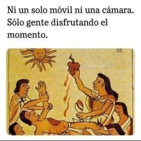 Illustration from ancient codex. A high priest extract a beating heart from a prisonier and offersbit to the sun.