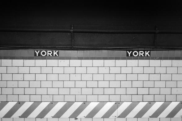 Tiled wall across the tracks of a subway station