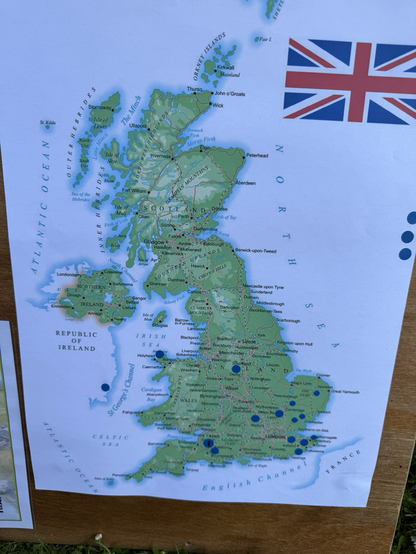 A colour map of the UK. There are 18 blue dots placed around the map showing where the contacts were made.