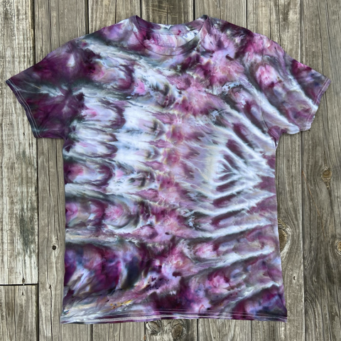 A cotton t-shirt has been ice dyed using the cosmic roll technique in shades of purples pinks and grays