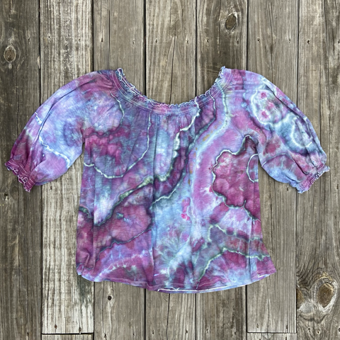 A cotton blouse has been ice dyed in shades of blues pinks and purples. It has been tied to create a geode pattern #cottagecore