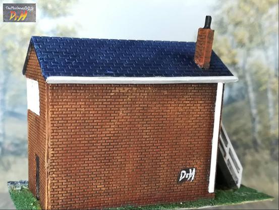 Rear view of the N-gauge switching house. With some added Dr H graffiti.