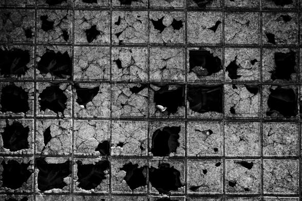 Shattered steel windows.