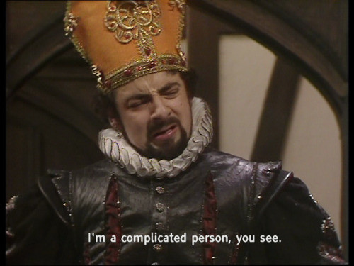 Screenshot from the BBC comedy series "Blackadder", the episode "Beer", featuring Edmund Blackadder as Cardinal Chunder.