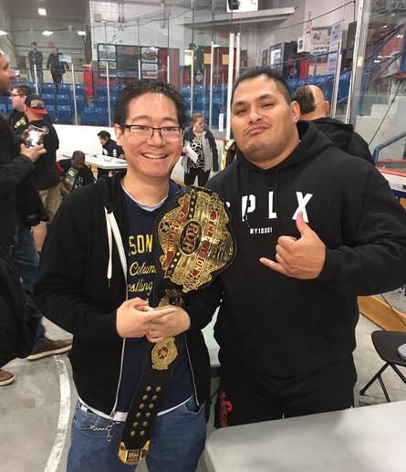 Me holding the ROH World Television championship while standing next to Jeff Cobb.