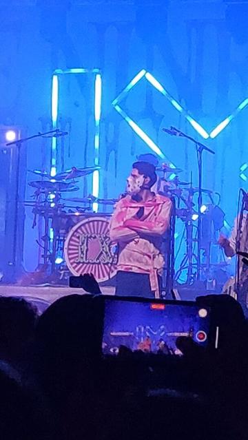 man on stage on a in straight jacket