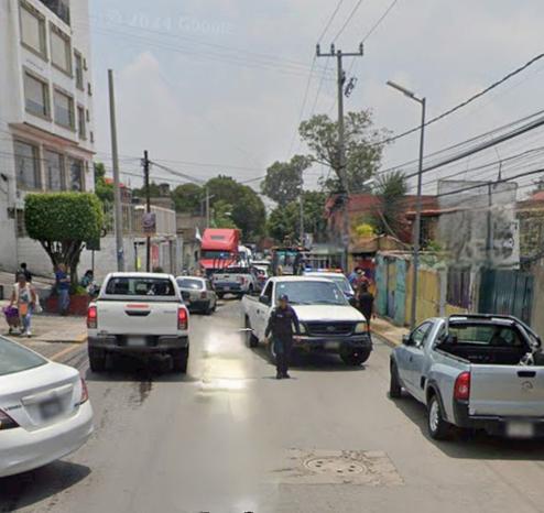 a photo of a street where I live with zero cycling culture, and narrow streets with almost no space for bikes
