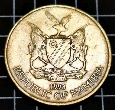 1993 Namibia 5 Dollars Obverse Coat of Arms of Namibia, State name in full, and year of issue. Script: Latin Lettering: UNITY LIBERTY JUSTICE 1993 REPUBLIC OF NAMIBIA