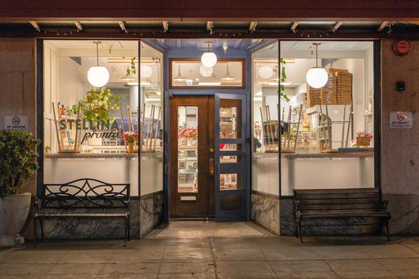 A night photograph of a restaurant called Stellina Pronto.
