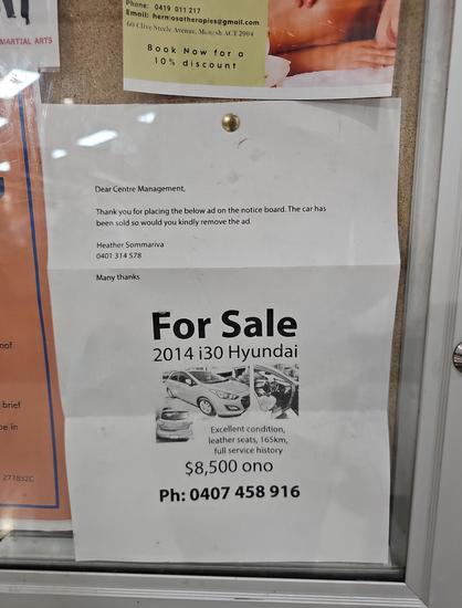 A sign advertising a car for sale. The sign is a printed email reading "Thank you for placing the below ad on the notice board. The car has now been sold so would you kindly remove the ad".

This email has been placed on the notice board.