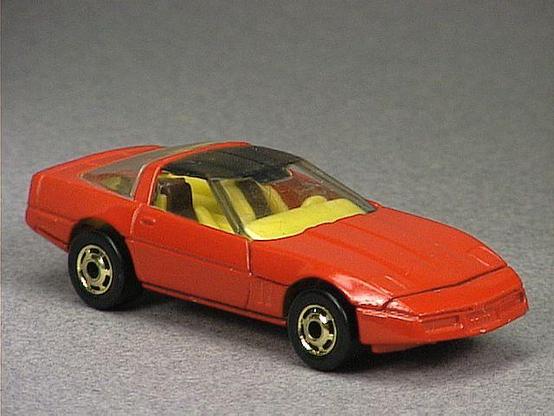 Released in 1984, Red `80's Corvette of 1984 Hot Wheels with Gold Hot Ones wheels. Notes: Based on the Chevrolet Corvette with lift up hood. Packaging: 1984 Blister. Metal Body, Metal Base. Made in Hong Kong. Scarcity: 3/10