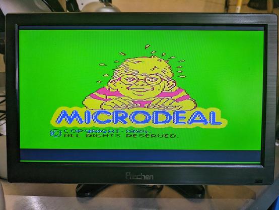 A loading screen for King Tut showing the Microdeal logo on the Dragon 32.