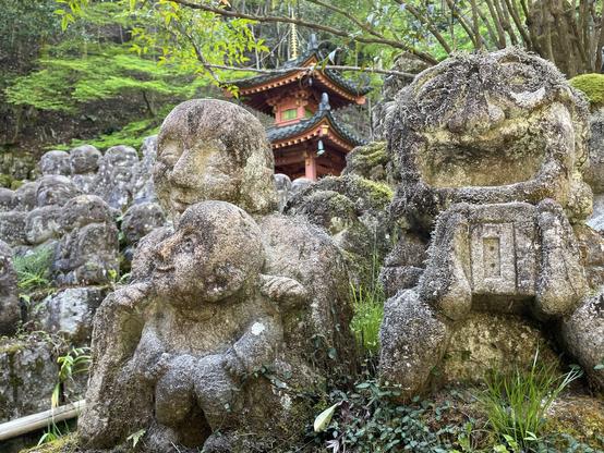 Pagoda and arhats, with the one on the right looking like us tourists