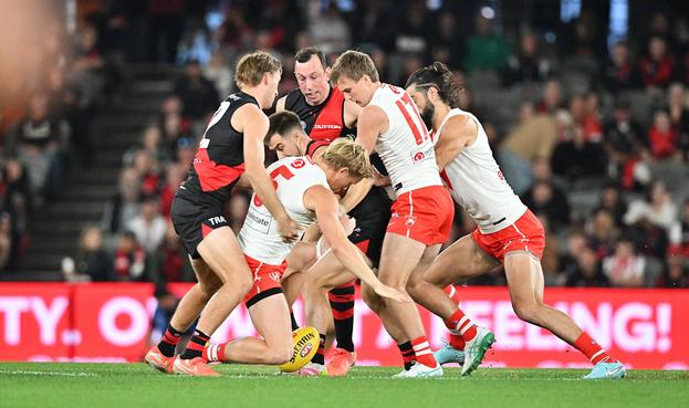 Mad scramble for the ball at the opening bounce. (Kim Densham/AFANA)

https://www.afana.com/gallery/essendon-vs-sydney-round-9-2025-marvel-stadium
#AFANA #AFL #EssendonBombers #sydneyswans #sportsphotography @densham_images