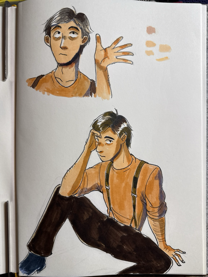Photo of sketchbook featuring my OC Jonathan in marker and fountain pen