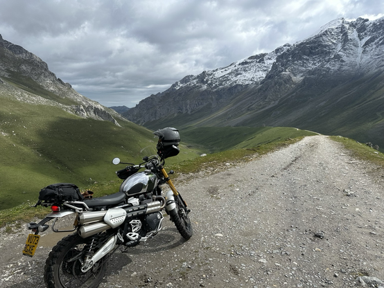 A motorcycle on a trail in the mountains