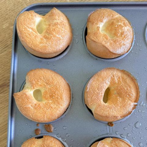 A close-up of the Yorkshire Puddings still in the muffin tin.