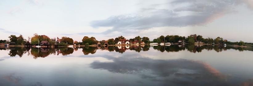 A twilight panorama view of the south bank of South Walsham Broad, Norfolk, UK