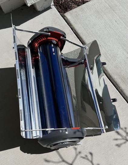 Solar oven with mirrors open and brownies inside