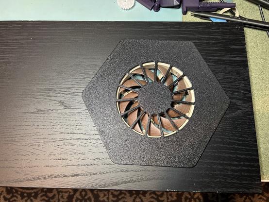 A black board from an IKEA BILLY.  It has a Noctua fan in a hexagonal surround near one end.