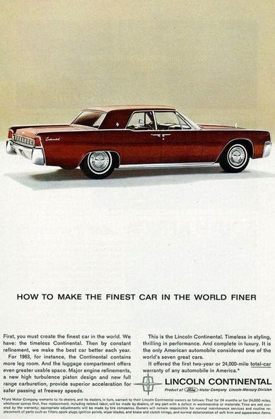 "How to make the finest car in the world finer." The car is seen from the rear and to the side. It is a dark red.