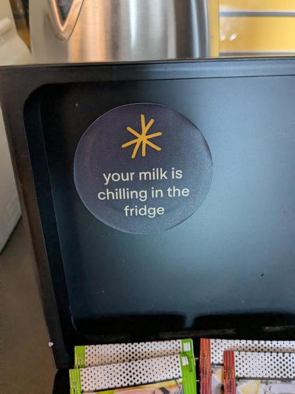 Sticker in my hotel room that says "your milk is chilling in the fridge"