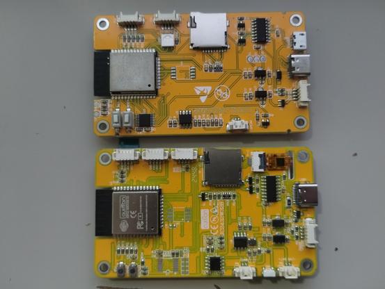 The back side of the different boards. This is where we see quite a bit of difference between the two boards. (TOP) this is the old board, it has both micro and USB-C connectors, is missing a port a long the top of the board, doesn't have the touch panel connector. The serial chip (I believe) is in a slightly different place. along the bottom it has different push buttons (actually like these buttons a bit better) It also has a speaker connector, but is missing a battery connector and another button. The RGB LED is also on the back side on this board. The identifier is ESP32-2432S028 (R) 

The board on the bottom has quite a bit more traces that can be seen on the PCB and looks like it has some other components on it. This board only uses USB-C. The board has the label Cuition JC2432W328 (C)