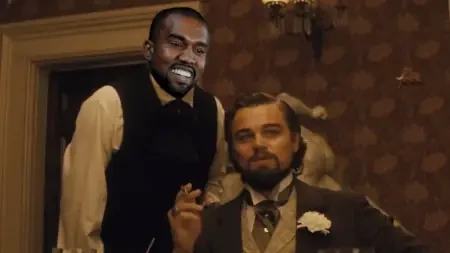 kanye west as stephen (in original jackson) next to canide (dicaprio) in django unchained.