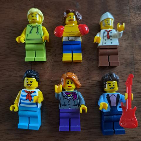 Six #Lego minifigures, a female bodybuilder, a boxer with floppy brown hair, a chef, a waitress,  the manager, and a rock star, with his guitar.