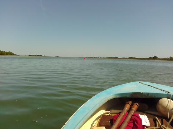 View from the rowing dinghy mid river looking east