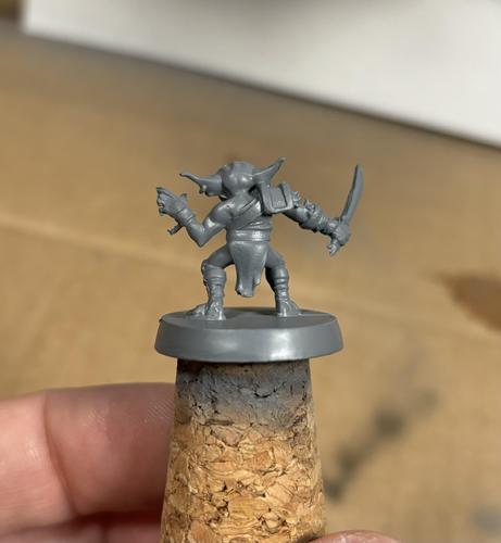 Goblin miniature from Hero Quest, base painted grey. Back.