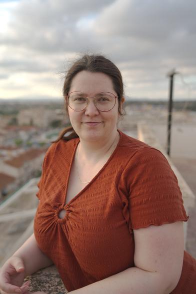 Image of my wife standing on the rooftop of our building in Spain.